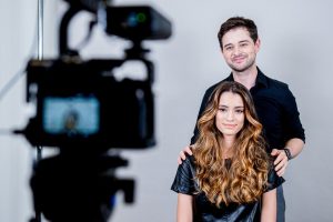 Commercial beauty photography capturing a professional hair styling session during a branded production in New York City