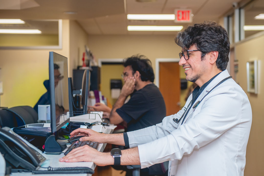 Candid lifestyle image of a medical professional working inside a NYC clinic