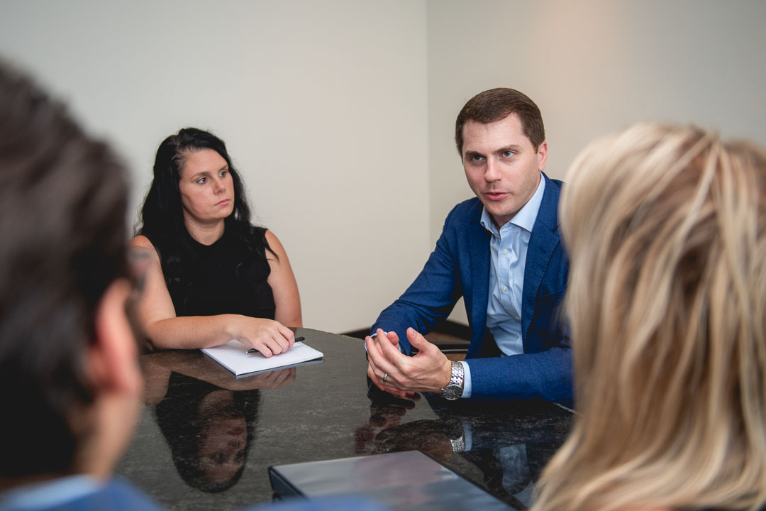 Environmental corporate image showing professionals collaborating during a meeting in NYC