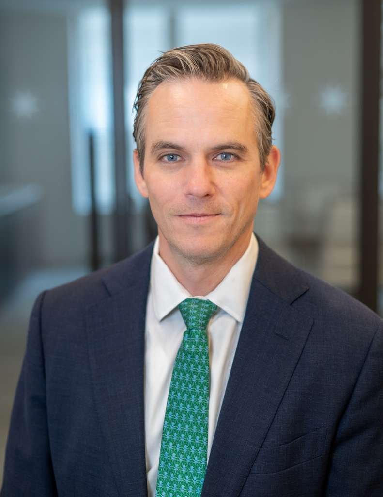 On-Location Headshot Photographer in NYC. Environmental headshot photographed in the workplace to reflect the professional’s role, personality, and work environment.